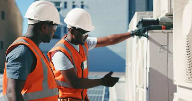 Technician checking airflow readings during precise residential HVAC system startup