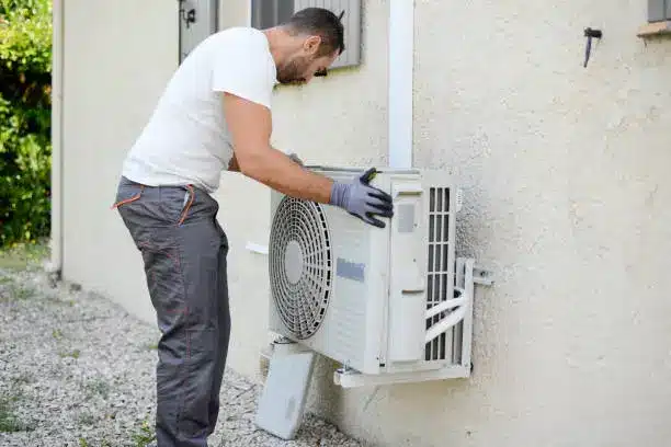 Homeowner receiving new HVAC system installation during whole-home equipment replacement